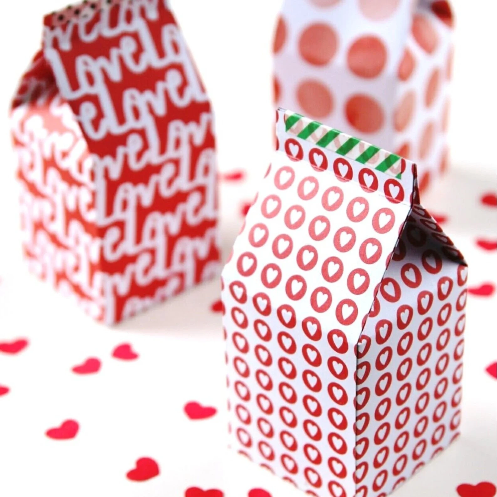 Red and white paper milk carton shape gift boxes.