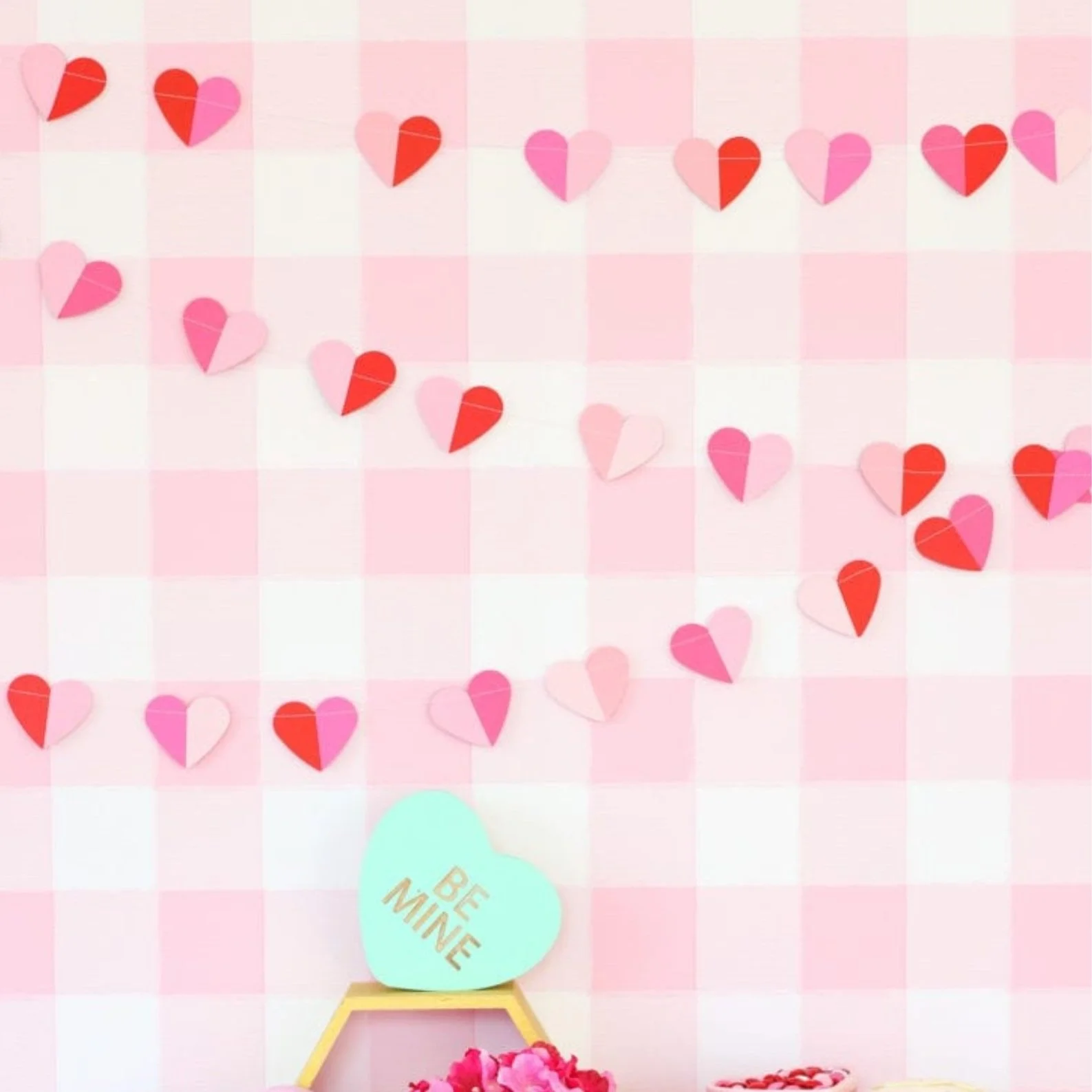 Paper heart garland hanging on the wall.