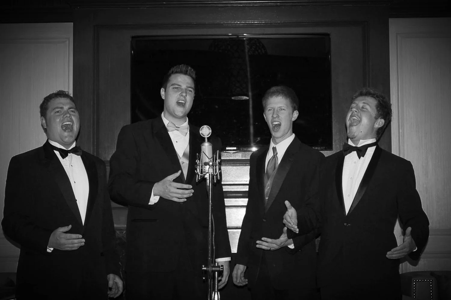 Derrek Wayne (far right) holds a high note with his a cappella quartet on Celebrity Cruises in 2012.
