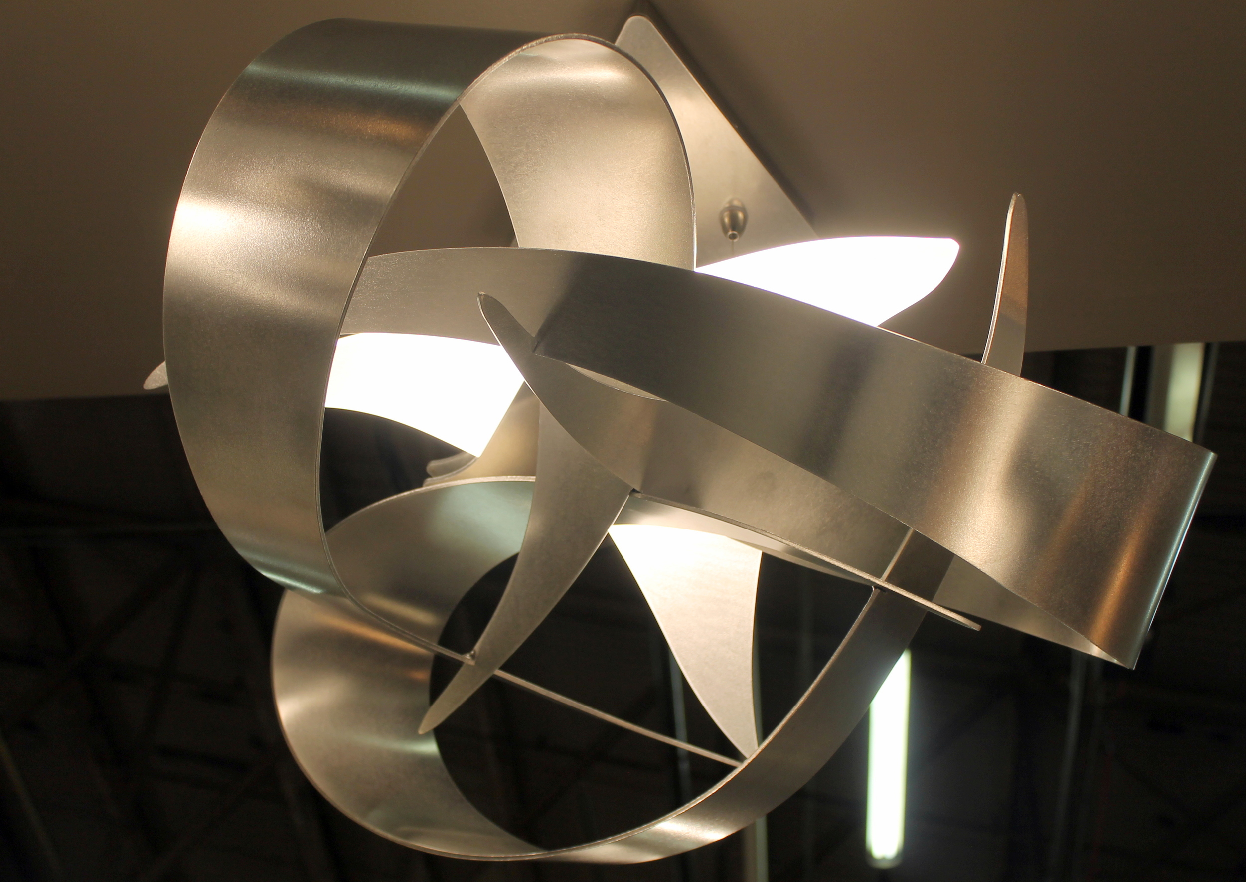 Pendant light from Hubbardton Forge, the oldest and largest commercial forge in the country had so many wonderful designs this year. The company was founded in 1974 - Watergate was the big scandal, The Sting was the box-office hit, and artists and entrepreneurs George Chandler and Reed Hampton fired up their first blacksmithing forge in a drafty old Vermont barn. With anvils, swage blocks, trip hammers and other tools from a bygone era, the two set out to revive the nearly forgotten craft of hand-forging raw metal into functional art. Their innovative designs became recognized for their simplicity and integrity. From these humble beginnings, one of the most respected brands in the industry was born. Today, Hubbardton Forge is the oldest and largest commercial forge in the country with a team of over 200 people creating hand-forged lighting of timeless beauty and artistry…an American wrought-iron renaissance. For more and to view their entire product line please visit their website. 