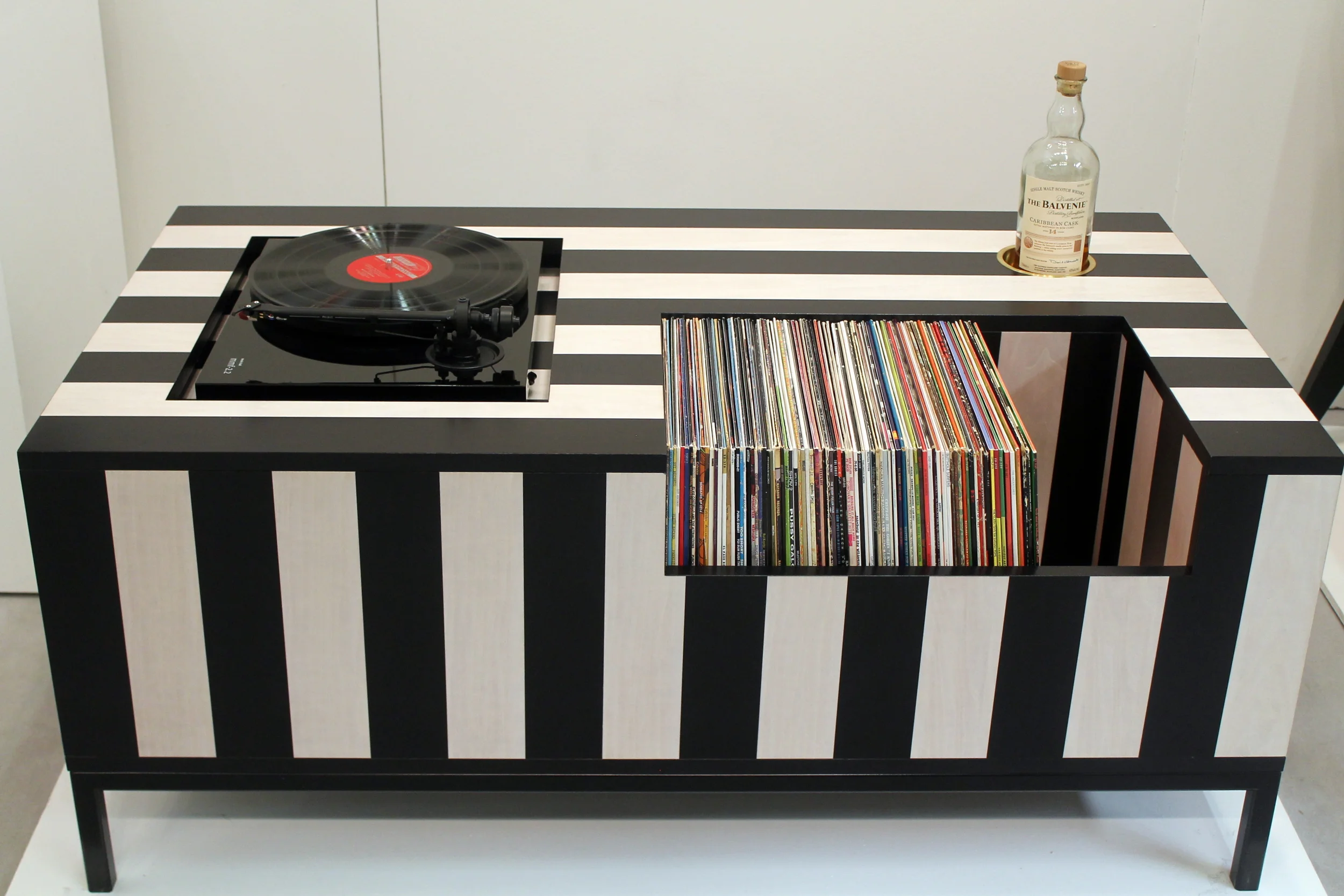 Everything old is new again and this Kickback Coffee Table is the perfect example. This table was designed for the music lover who takes his downtime seriously. It’s the ultimate table to come home to after a long day—with a recessed area to house a turntable, a side cutout for an amp, a niche for over 120 albums, and a solid brass inset to hold a whiskey or wine bottle (or ash tray if you live in a legal state). Kick back, enjoy a drink or a smoke, and when side A comes to an end, no need to get up—just lean over, flip the record, and pour another finger. For more information visit the Atocha Design website.