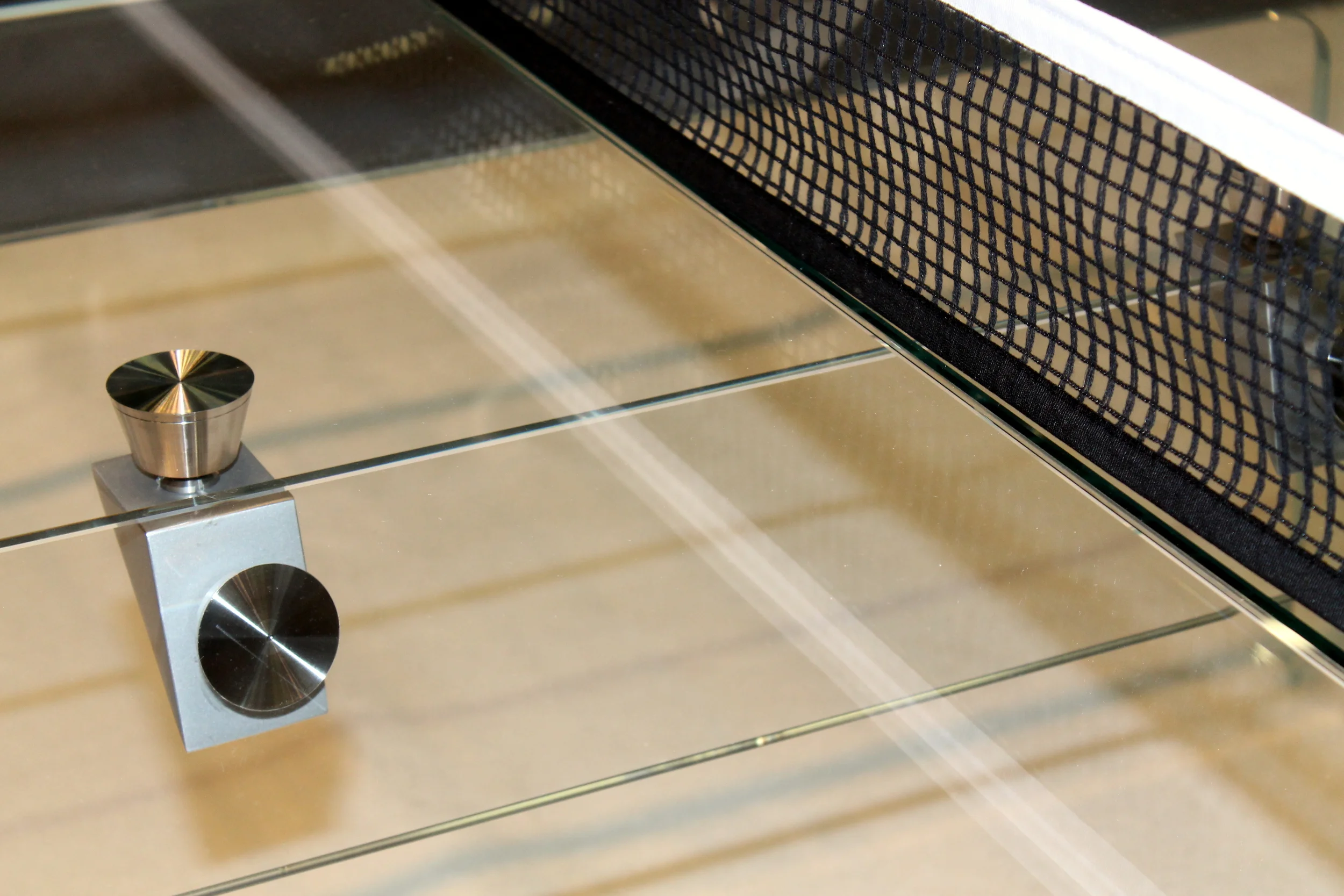 Ping Pong for the luxury set. This gorgeous glass ping pong table designed by Calma e Gesso brings the game to a whole new level. For those seeking to bring recreation out of the basement and playroom this may be what you're looking for. Grace and elegance, clean modern lines make this luxury item perfect for the home for those who work hard and play hard. Until now, one may not place the words sophistication and ping pong together in the same sentence. How much will this set you back? Just a cool $30K!