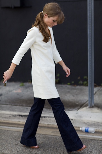 This simple white tunic comes to us from Emerson Fry. Worn over full pants and with heels the tunic has a very urban feel to it, yet alone it could be worn at the country or the beach. (Tunic is no longer available.)