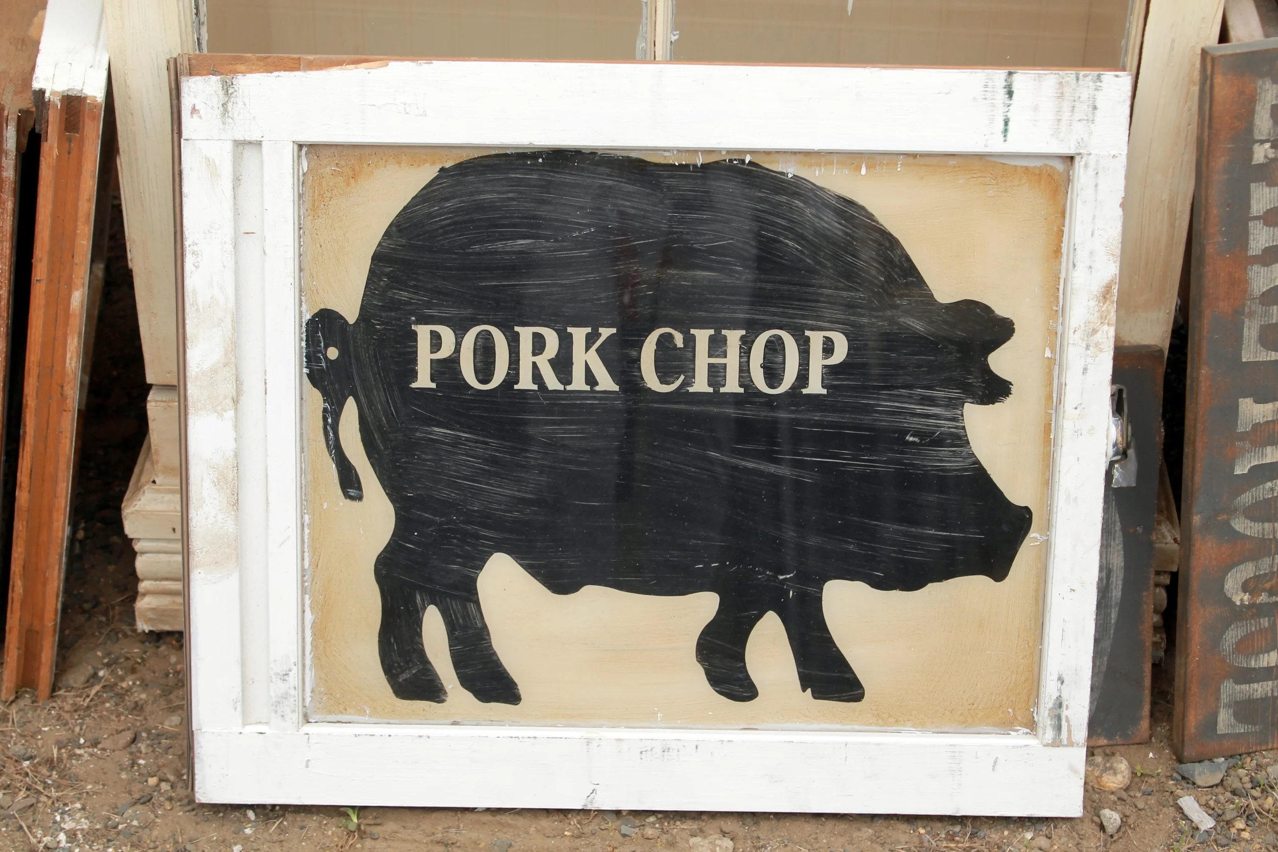 This old window frame was repurposed and repainted with a modern poster done at a local print shop. It would be a fun piece to add to a kitchen art collection. 