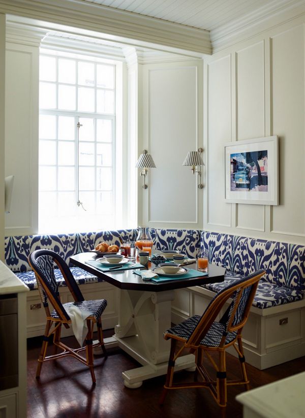 The blue and white banquette offers a modern touch to a country inspired kitchen. Image via Desire to Inspire. Ashley Whittaker Designs. 