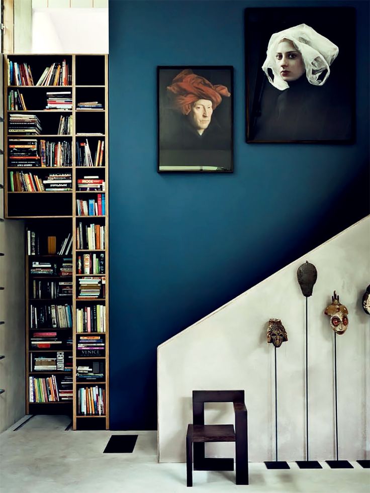Urban and Lofty. An indigo wall gives this modern space with clean lines personality and depth. Image via Decor8