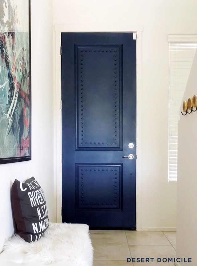 A powerful indigo colored door takes center stage. 