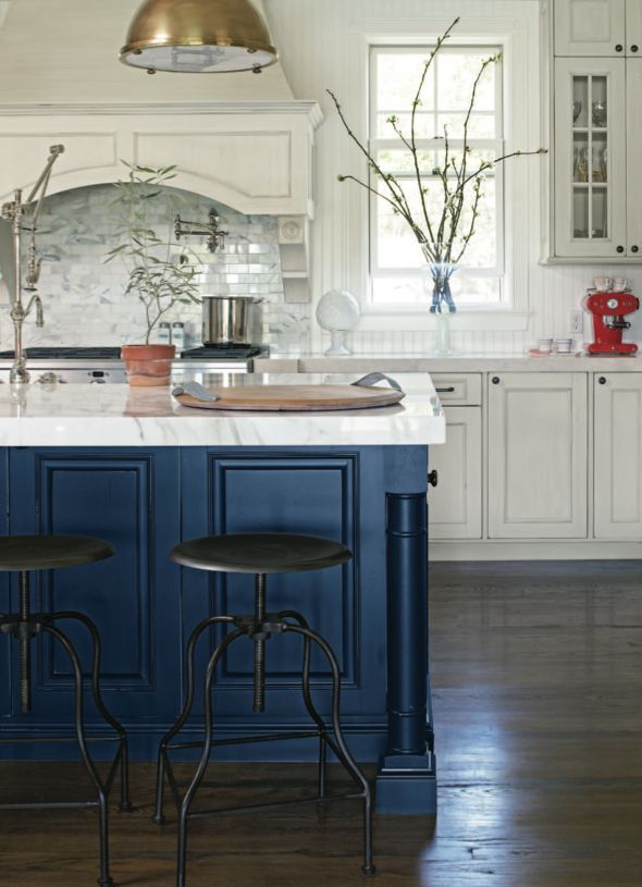 Instantly calming, an indigo island adds a bold pop of color to the busiest room of the house. Image via Houzz.