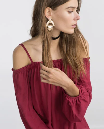 Red off the shoulder shirt by Zara