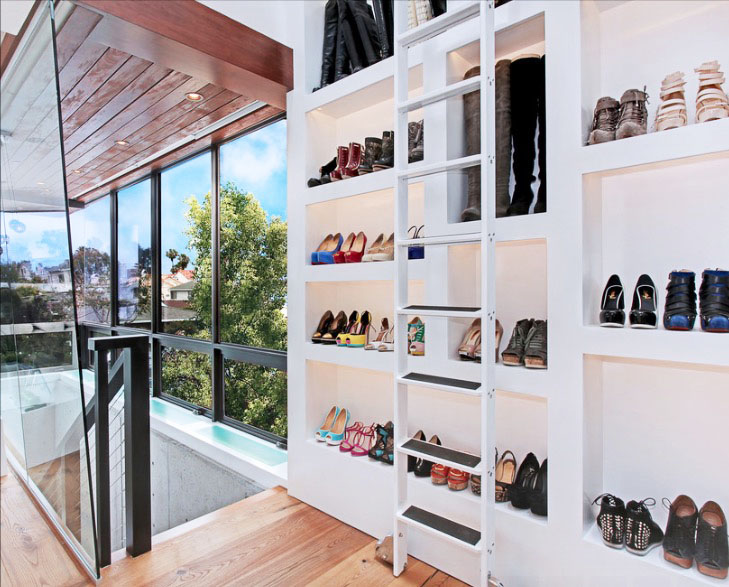 The many uses for the library ladder in the home. Image via Freshome