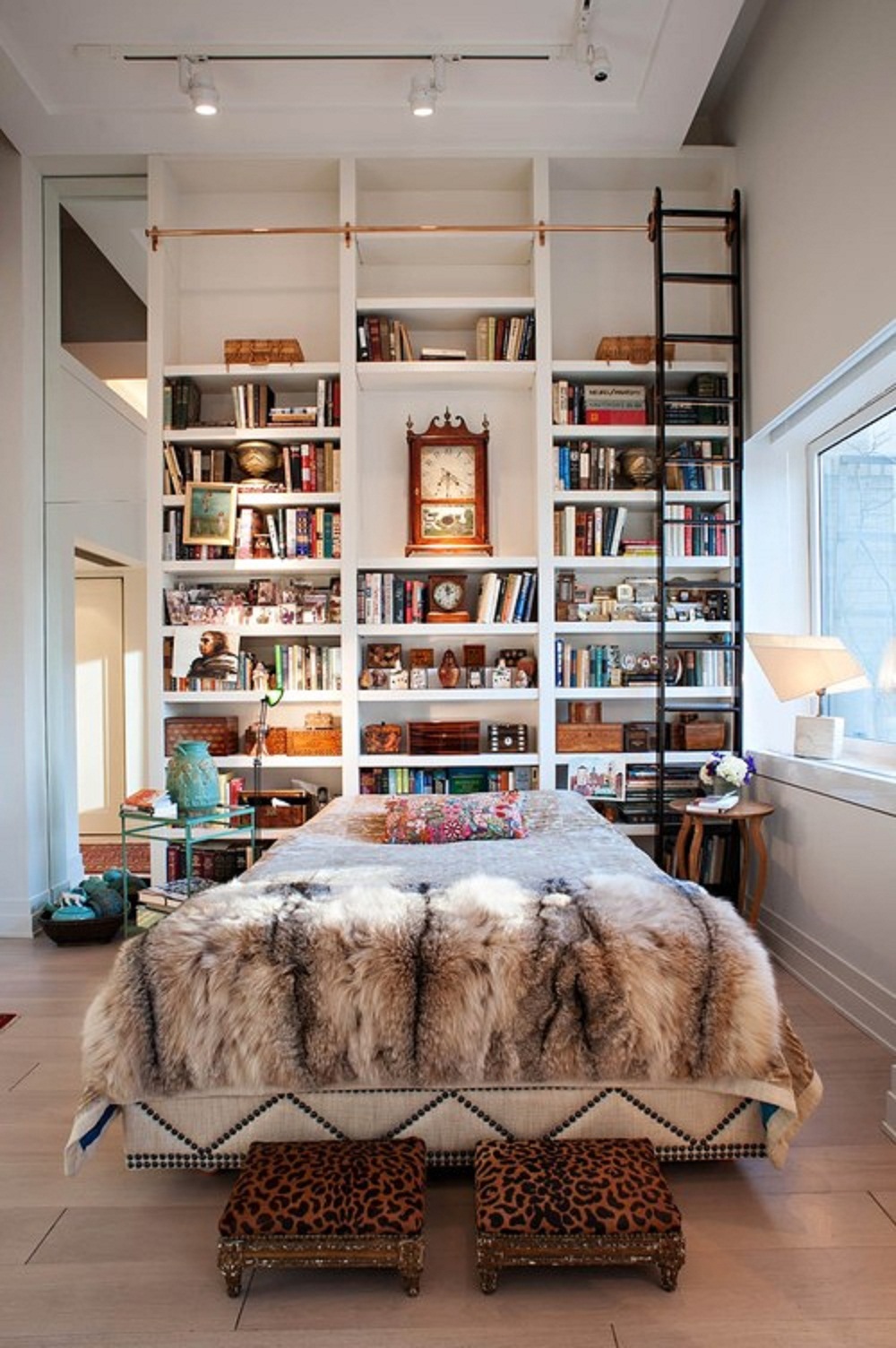 The many uses for the library ladder in the home. Image via Home Design Ideas