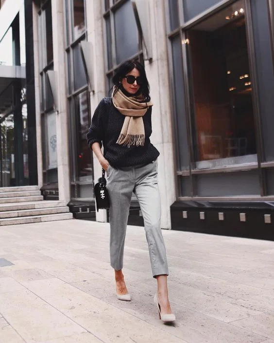 Celebrating the Little Black Sweater. Image via Styleholic