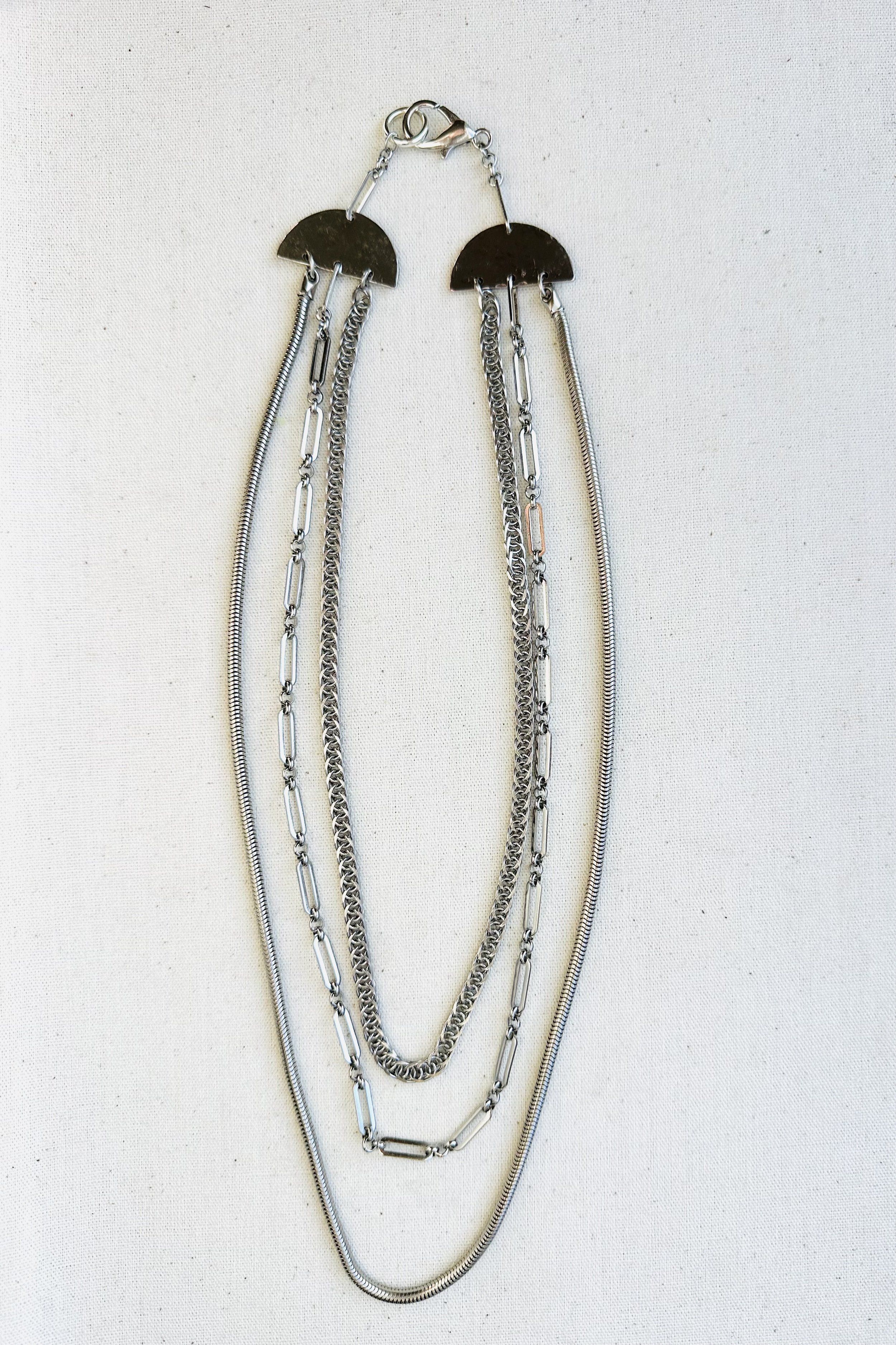 elaborate triple silver chains
