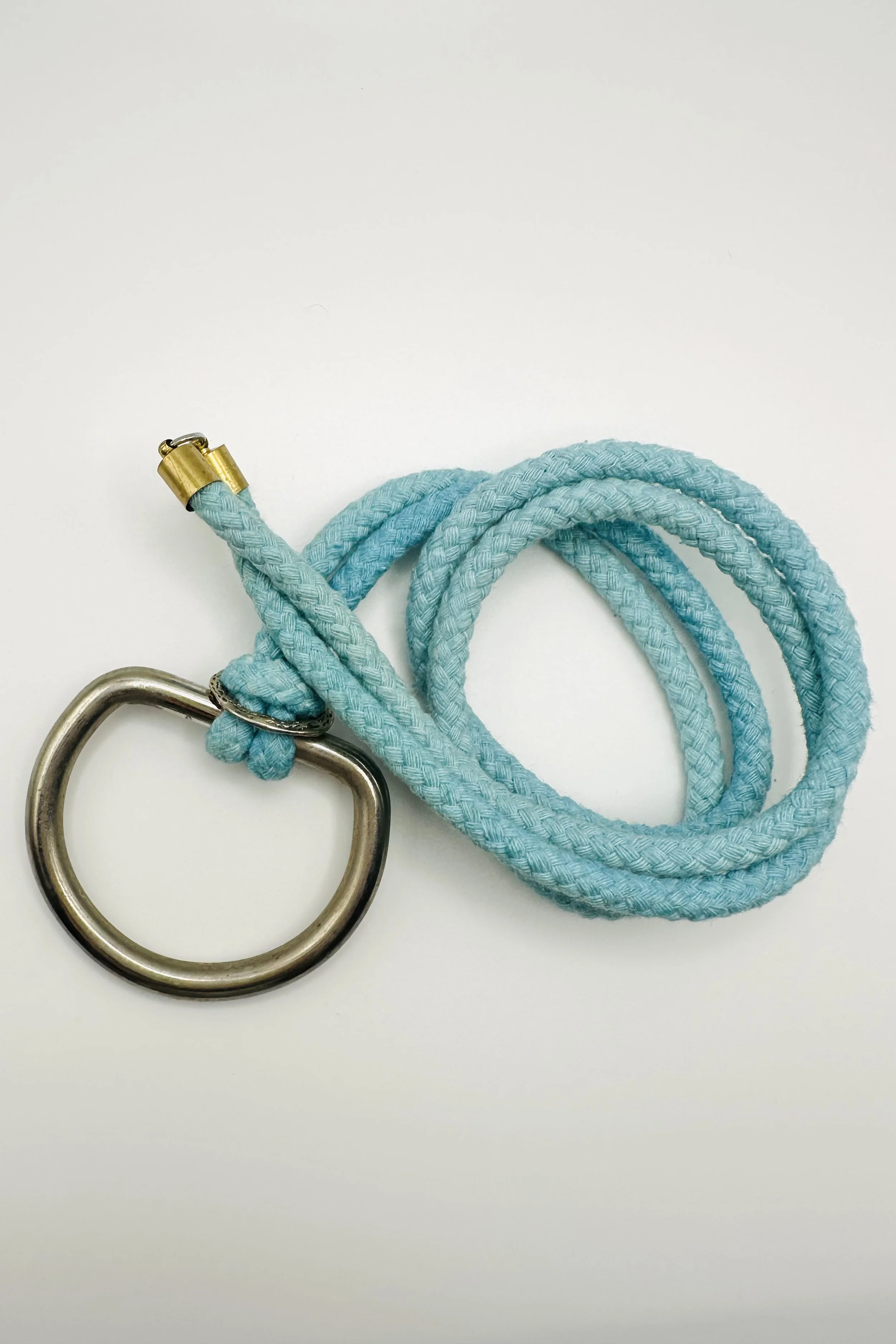 sculptural ring on blue dyed rope