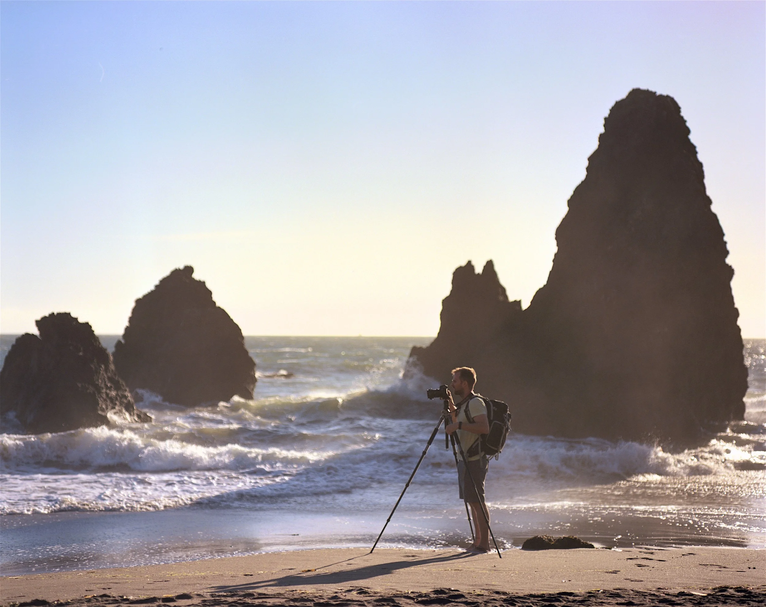 My friend Eric borrowing my tripod to get in on the Rodeo Beach action