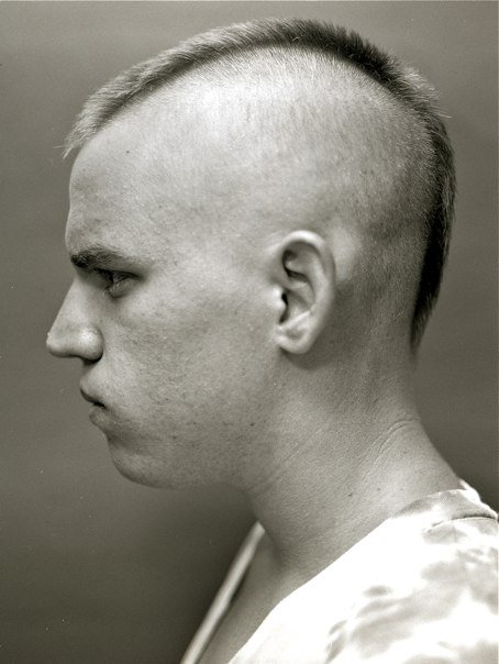 My brother Zach in 2010 appeasing me by letting me take his mugshot