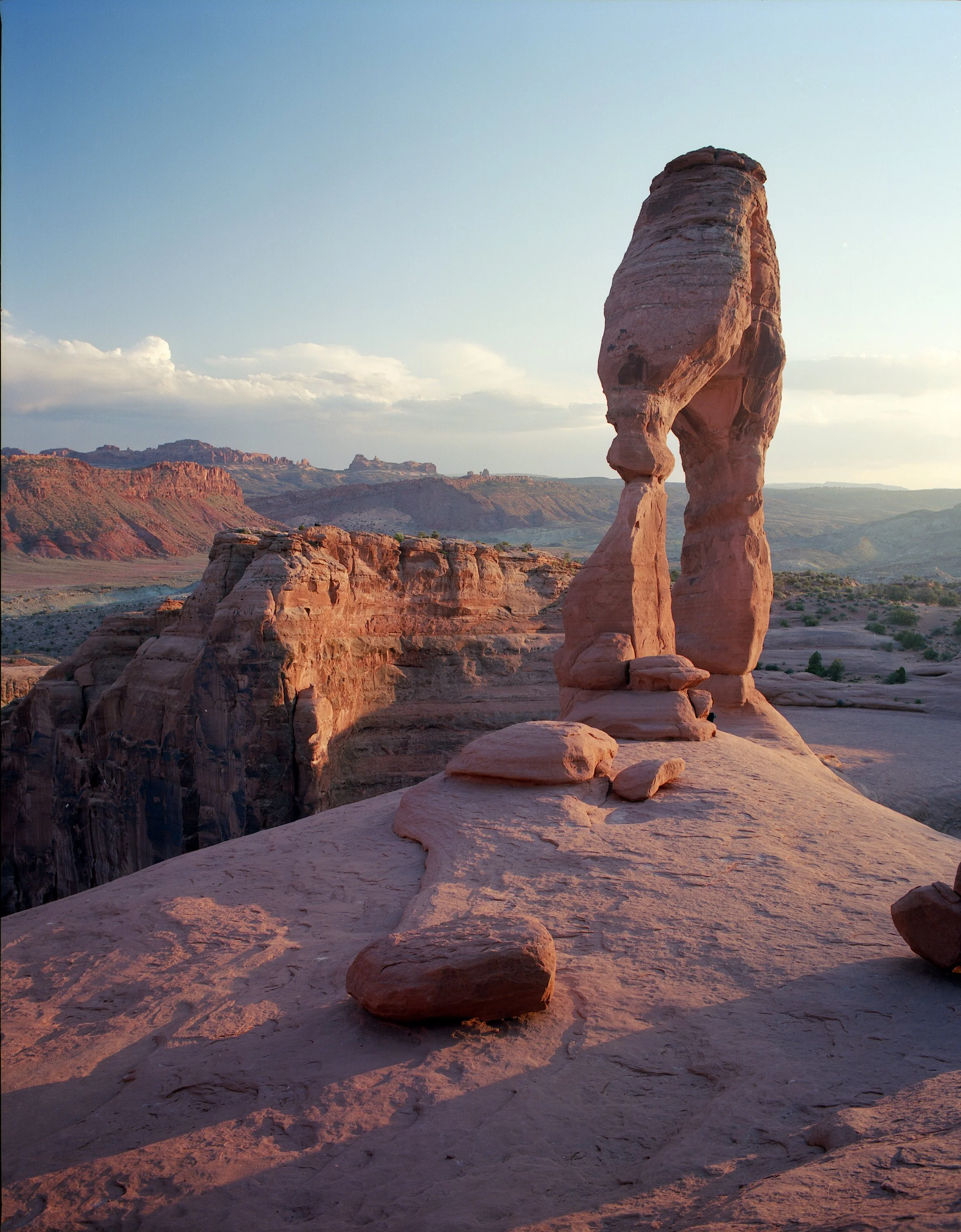 Delicate Arch, 2013. Handheld on 120 Kodak Ektar with Pentax 6x7 + 55mm f/4. Note the shadow detail in the canyon as well as the detail in the clouds.