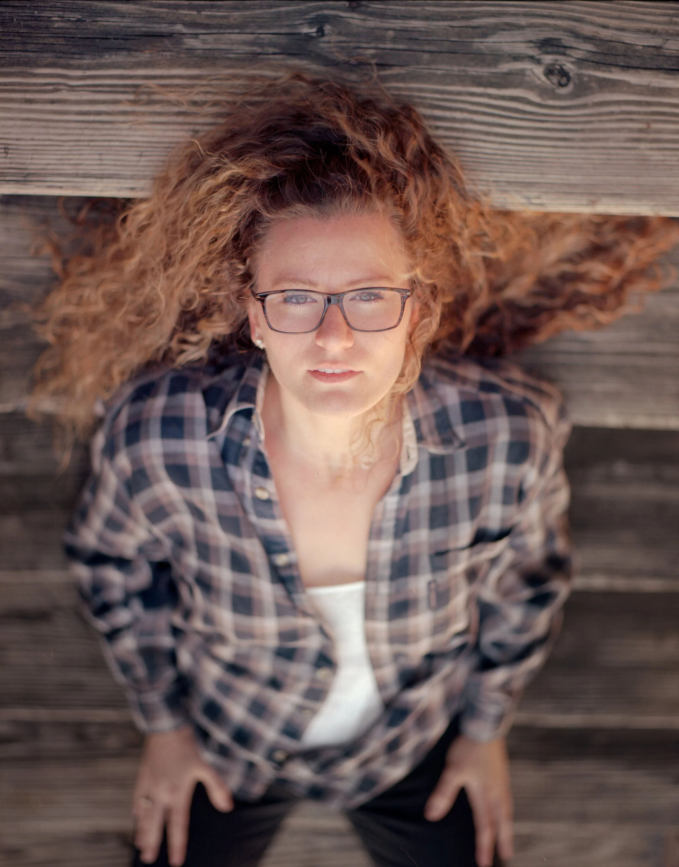 Jo in Alton, IL, 2017. Pentax 6x7 + 105mm f/2.4. Note the color pop of her skin and hair plus the wood. 