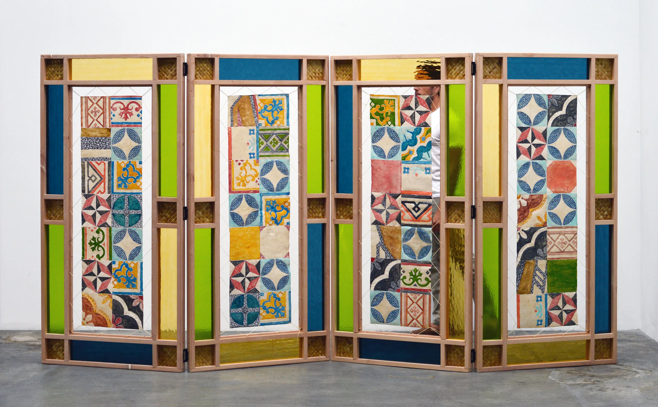 Room Screen Kardinal 2019 hand carved water buffalo hide, oak, woven pandan leaf, acrylic paint, stained glass 72 x 145 x 2.5 inches