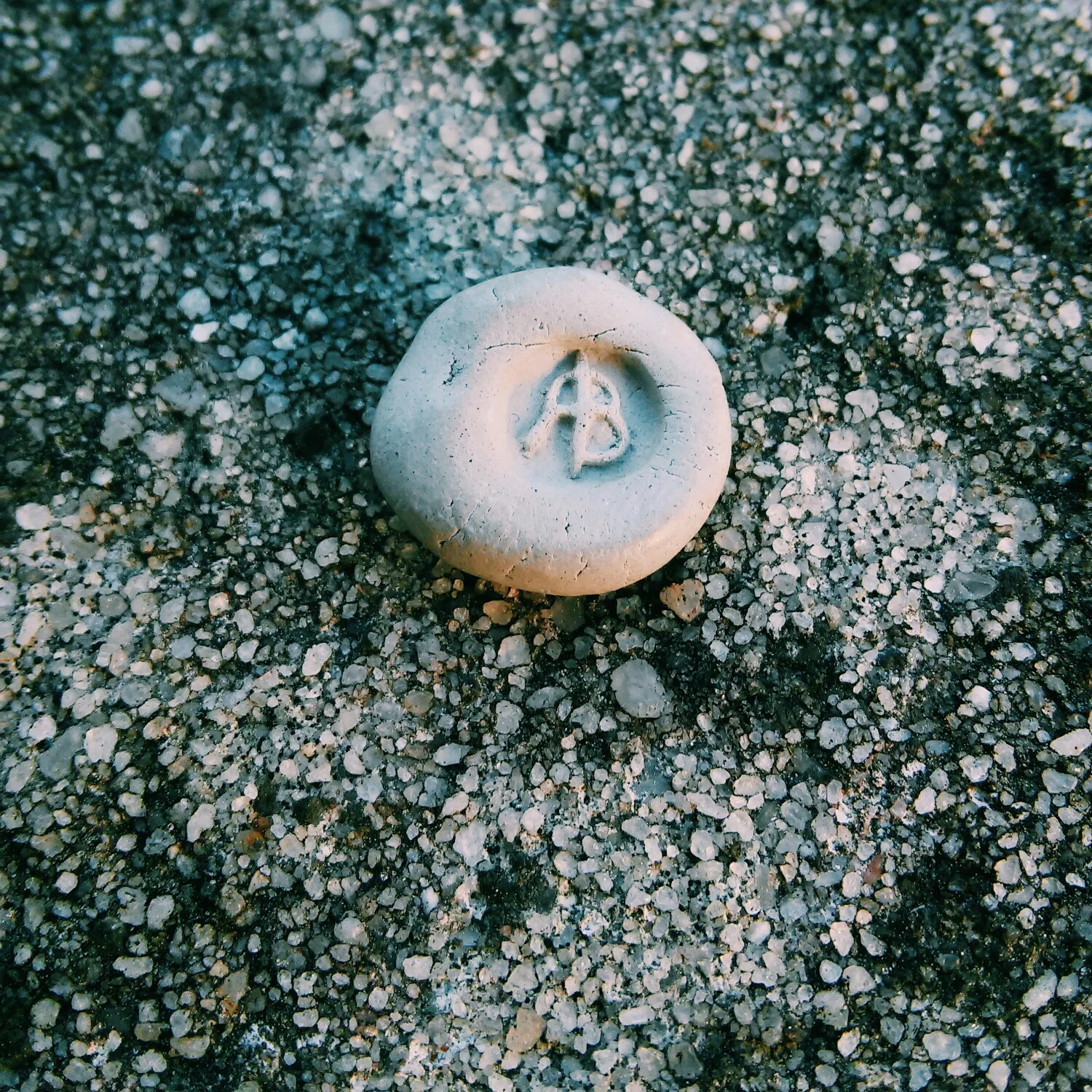 A ball of clay stamped with the new signing seal. 