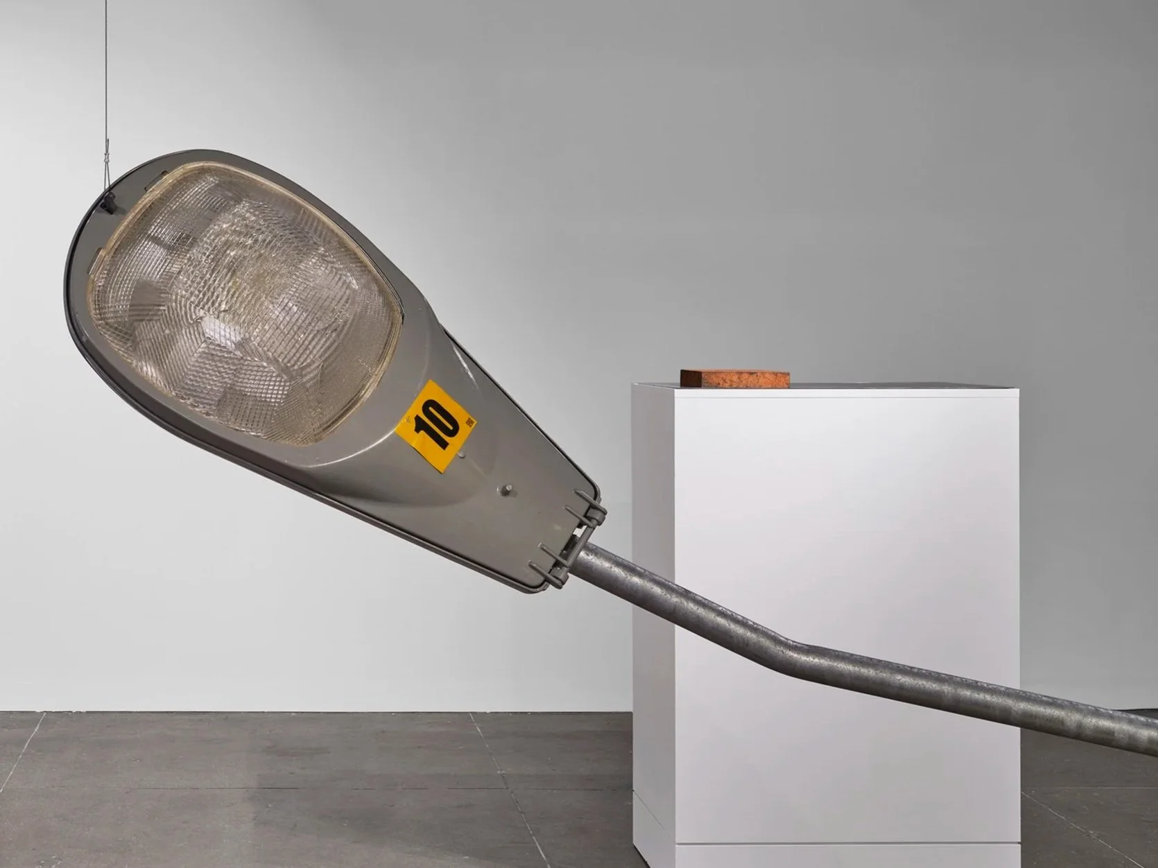 "Roadlight", 2026,
Decommissioned American Electric Lighting
high-pressure sodium street light fixture, sound, 18” x 120”