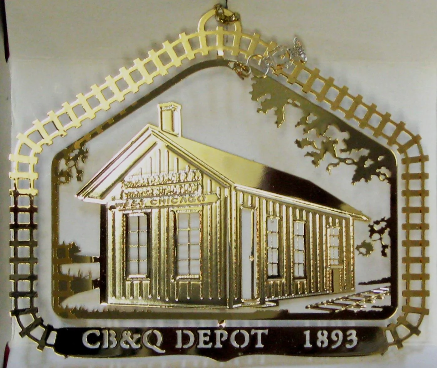 2001- CB&Q Depot ( Out of Stock) This Chicago, ,Burlington & Quincy Railroad depot was built c. 1893. It replaced the originaldepot that dated back to 1850 when the Burlington built its very first track from junction (now West Chicago) to Aurora. Today’s BurlingtonNorthern Sante Fe, our country’s largest railroad, began here. The depot was donated to the City by the Burlington in 1976. It has been moved from its original site on Wood Street and is now part of a railroad park.