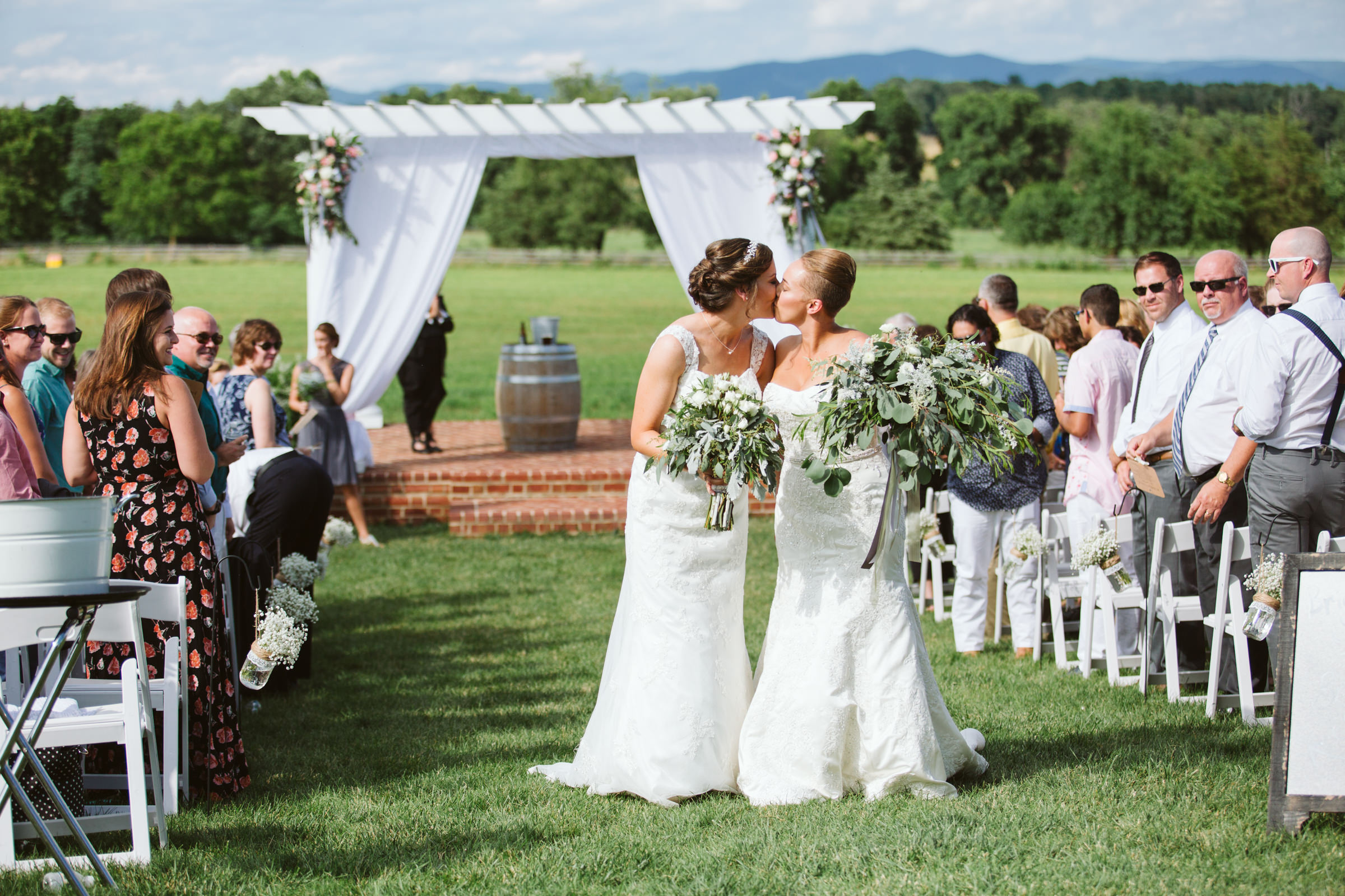 Same sex brides walk down aisle at The Columns at Six Penny Farm McGaheysville Virginia