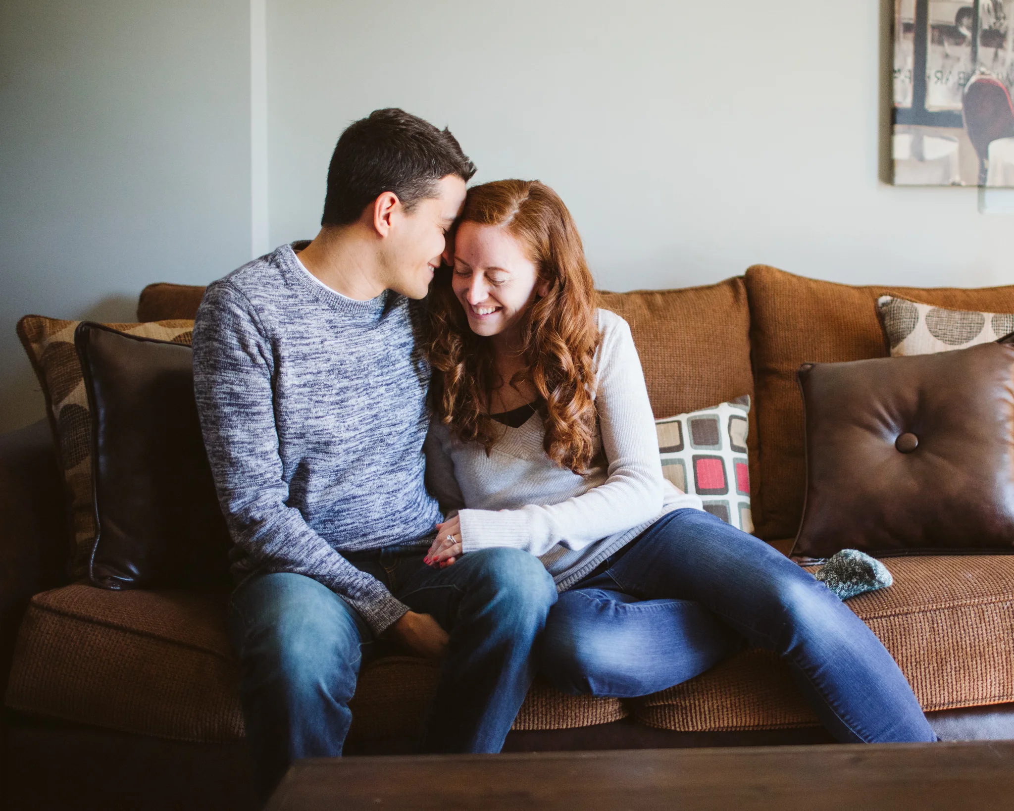 Couple on couch at home lifestyle photography session