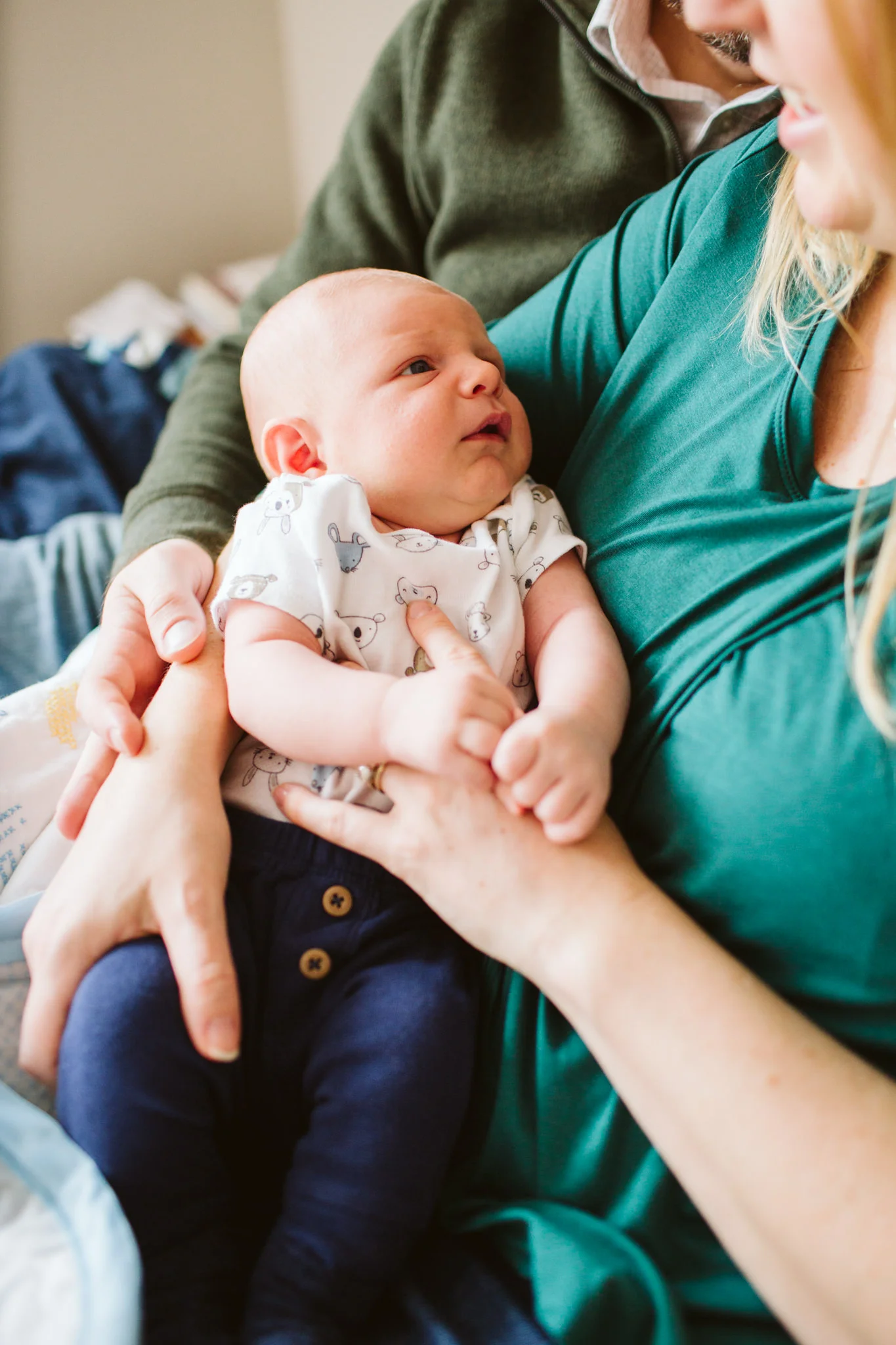 Newborn boy in mom's arms lifestyle newborn family session