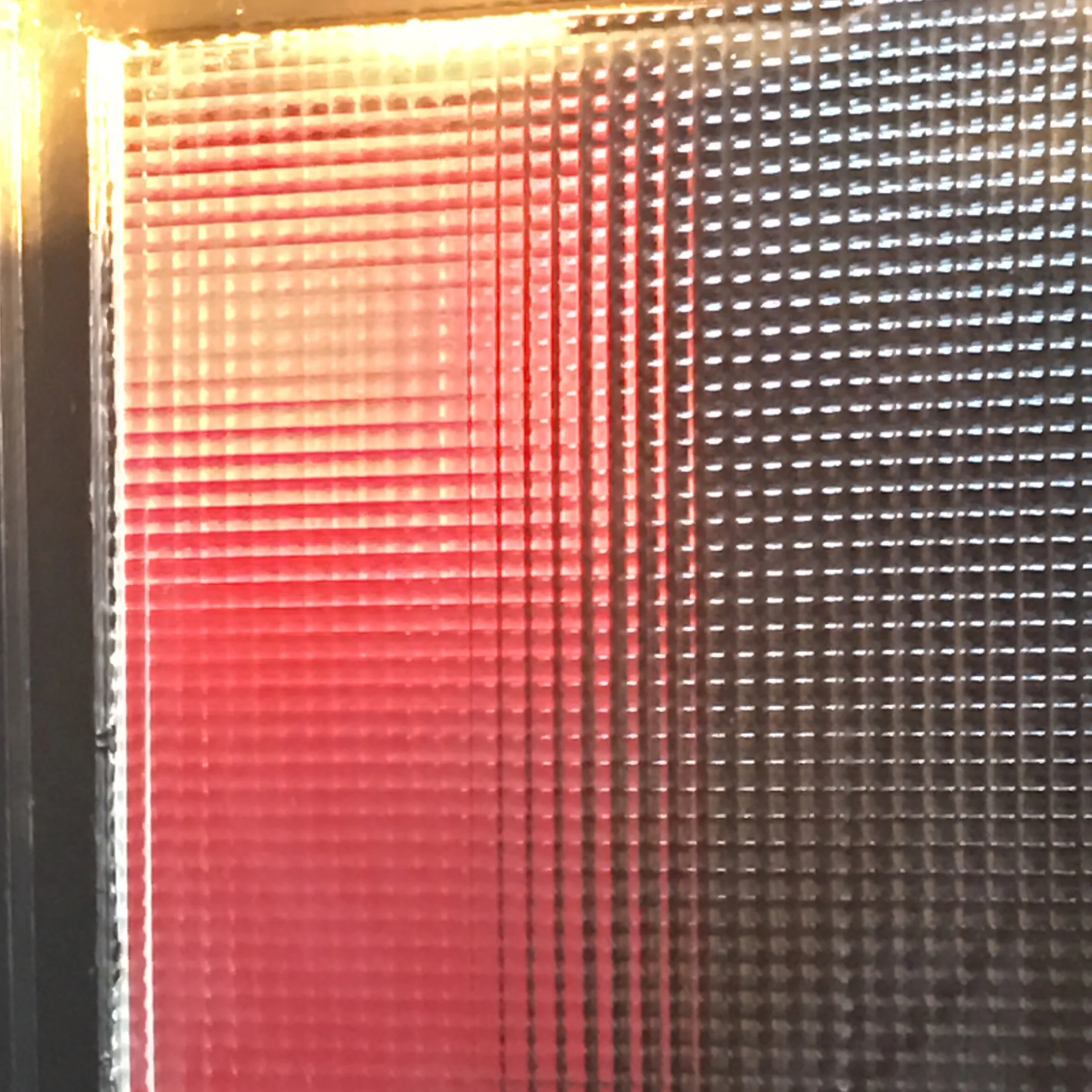 red through a waffled window