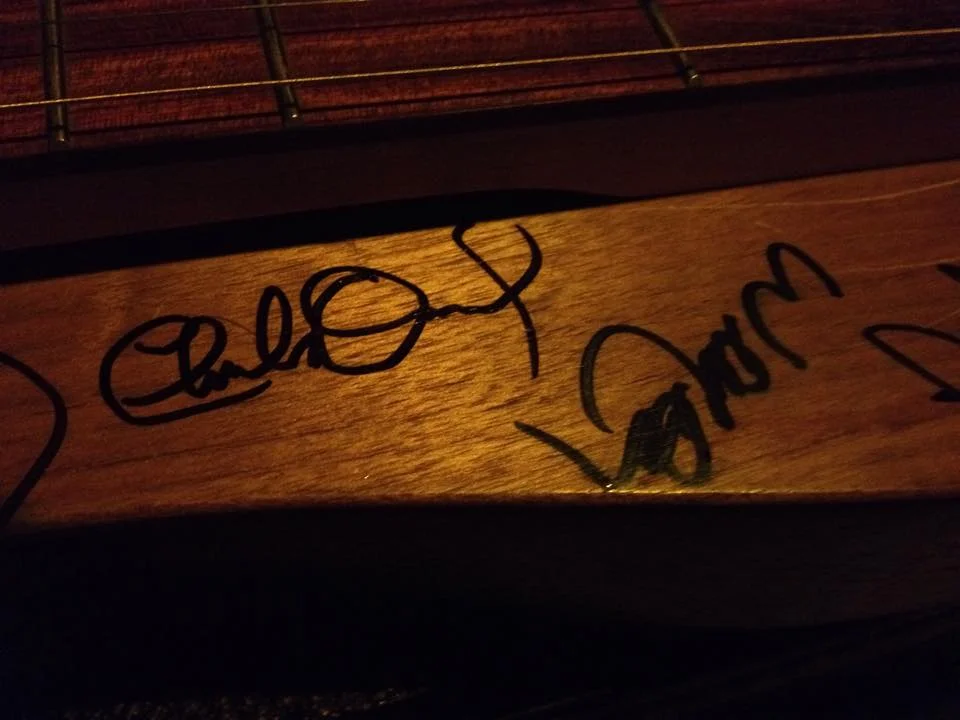 I had Charlie Daniels sign his name right next to Willie Nelson's!