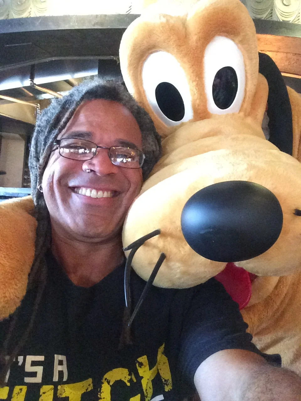 I won't stop sharing pics like this, but it will happen a lot less often. Me and Pluto on Boxing Day at Disney's Polynesian Resort.