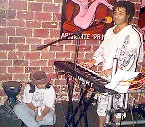 Performing on a Kawai K-1 at Java Jabbers in Orlando, Florida circa 1998. Monica Rabino is playing tambourine.