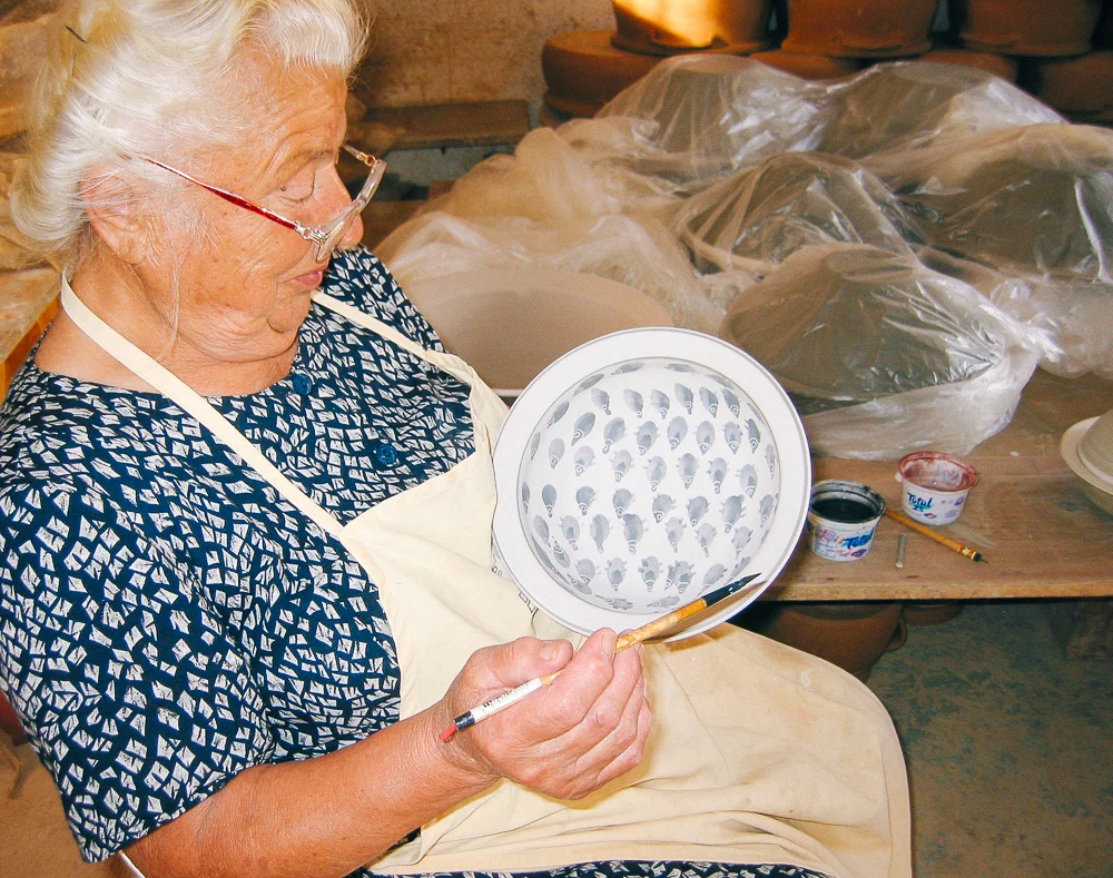 Katerina Lembesis is 86 years old and has been decorating pottery since 1950, alongside her husband, father and now grandsons. Her designs are inspired by the land and sea—the things she knows and loves best.