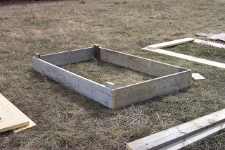 The first bed (from recycled lumber) is put together.