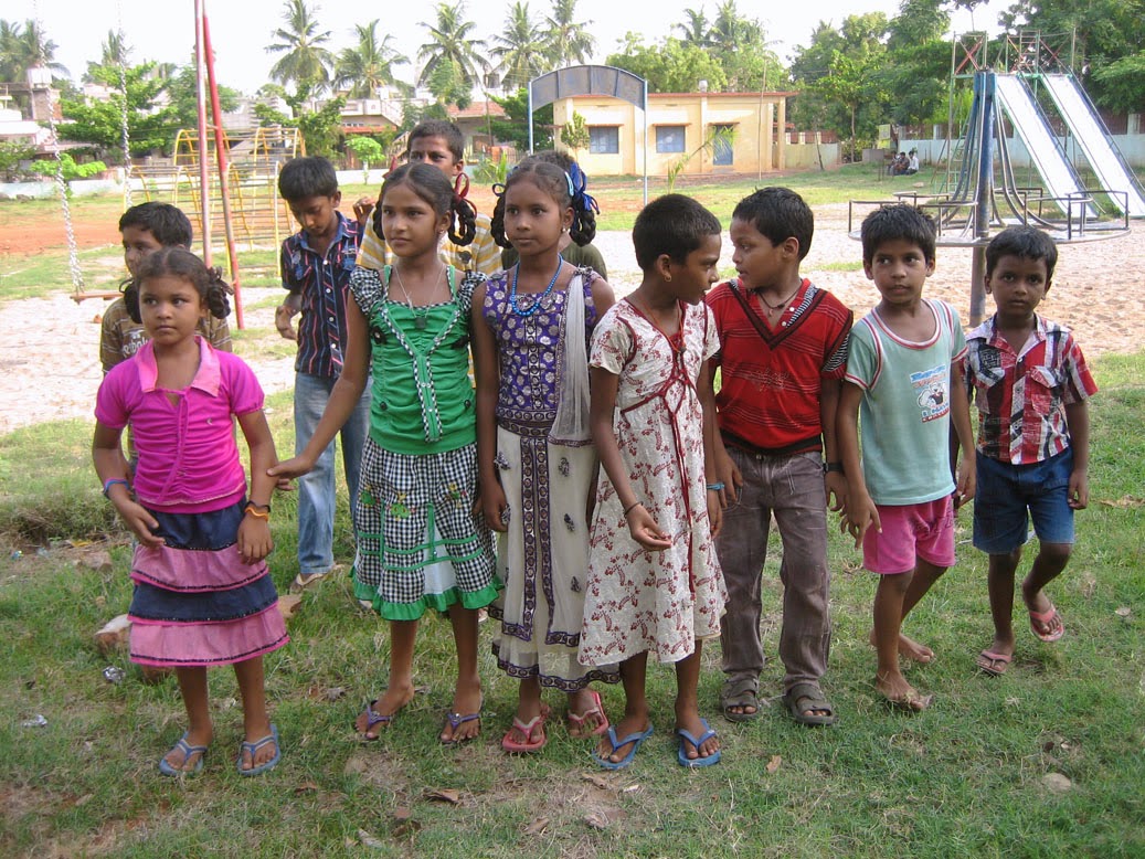 Hanging out at the playground beside Pastor Kumar's house