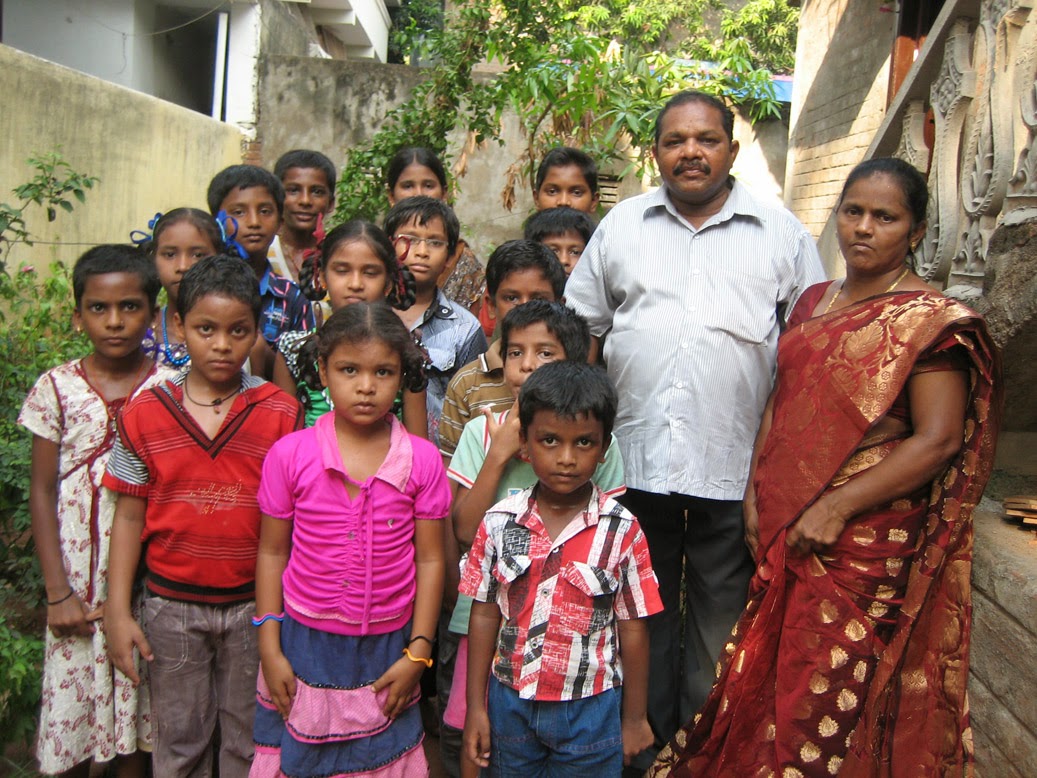 Pastor Isaiah and Mani with some of the children from Faith Children Home