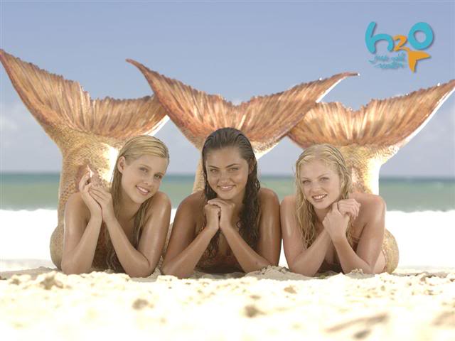 Claire Holt, Phoebe Tonkin, and Cariba Heine as the three original mermaids of H2O: Just Add Water (2006-2010) .