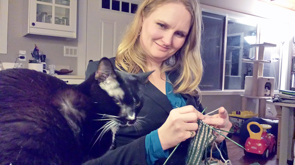 TC ponders whether to "help" with the knitting.