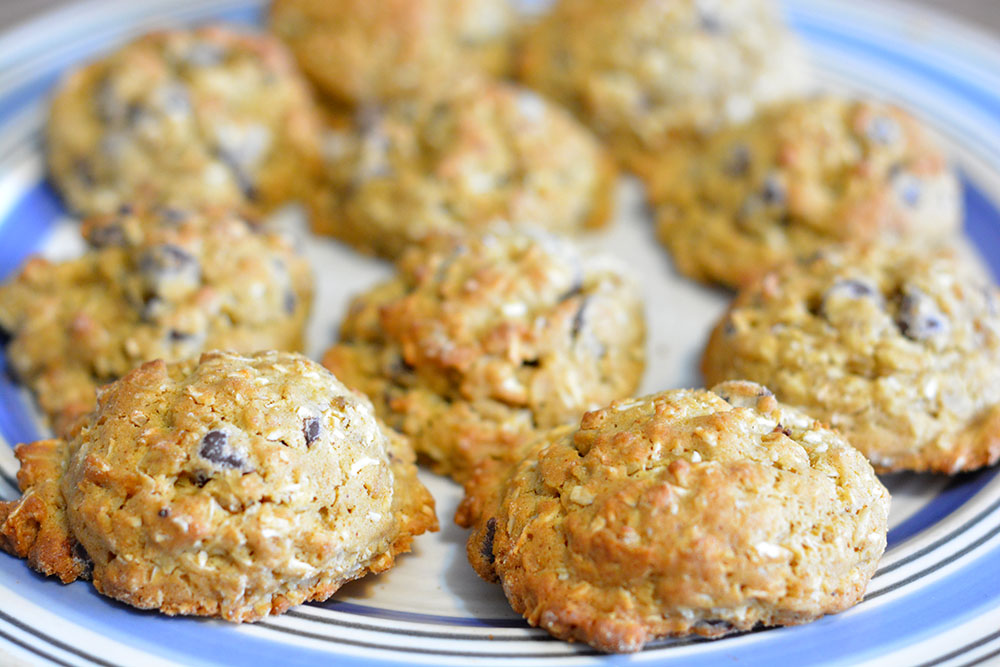 These awesome Chocolate Chip Cookies are full of healthy grains, fats, and have less sugar since they are sweetened with bananas! "Trail Mix In a Lump", as I like to call them!