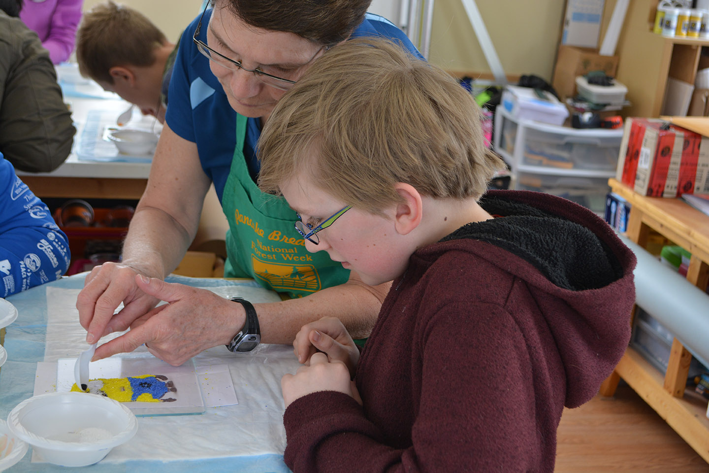 The workshop instructor, Sharon, helping Jabin fill in some tricky detail bits around the eyes.