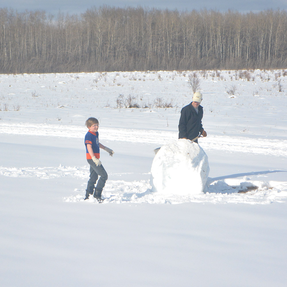 This base snowball became a ginormous seven-foot-tall snowman. Go, team Jabin!