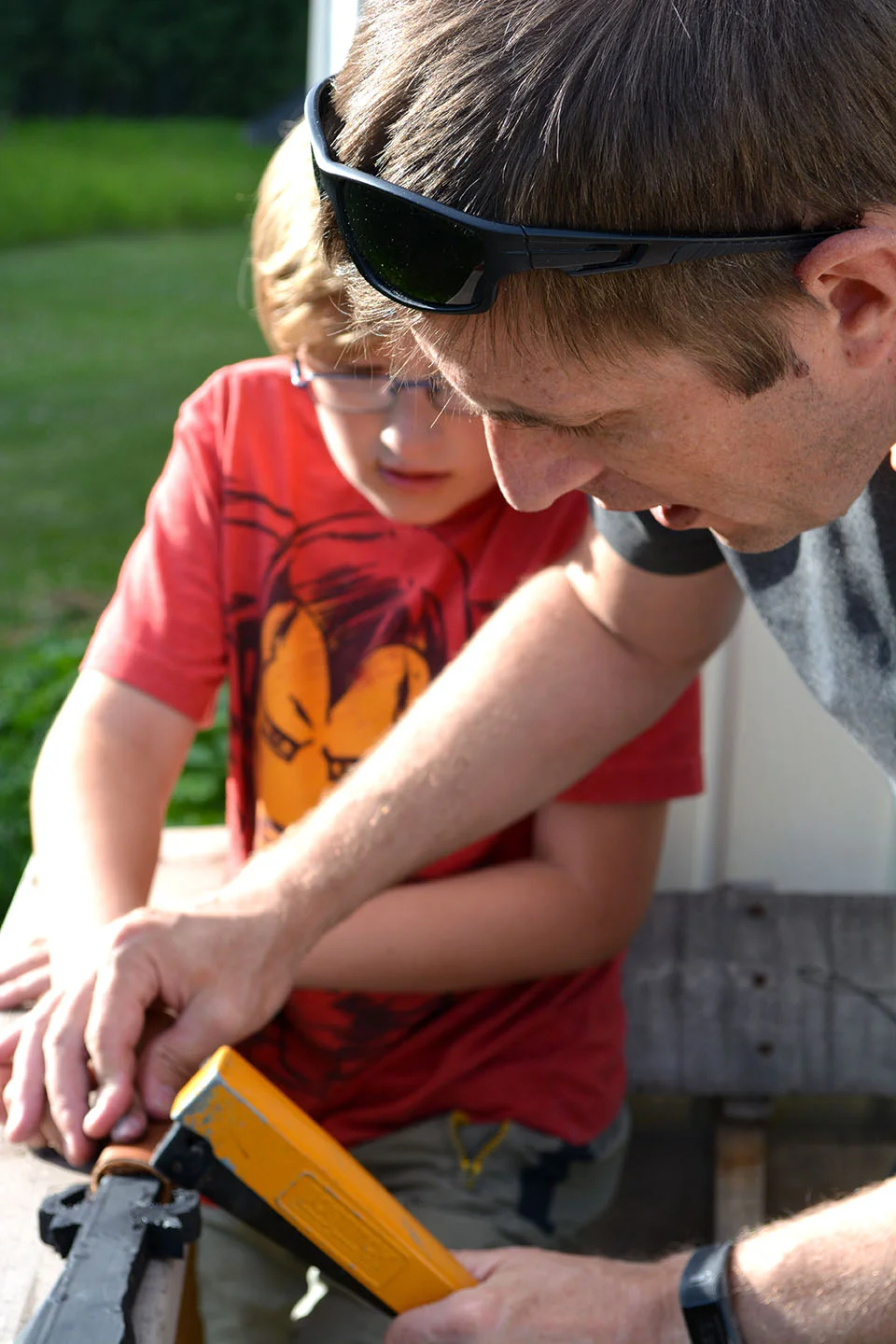 Father-son craft time: Jason helped the boys (and a few other kids, too) make their own wooden swords this summer, complete with leather-wrapped handles.