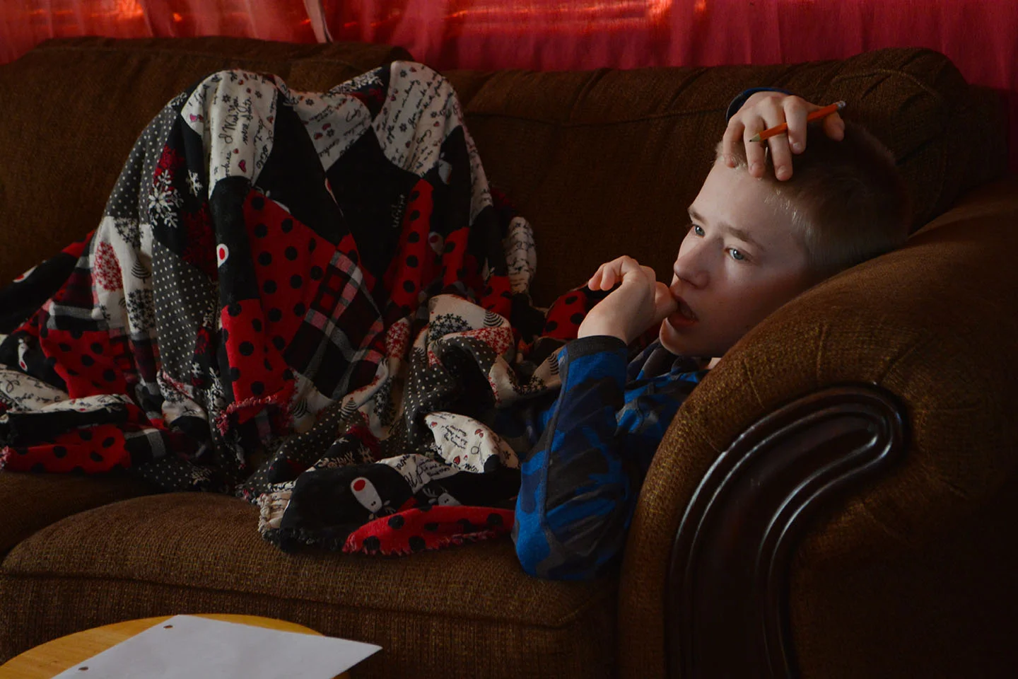 Noah's been fighting a cold for a few days. Nothing like snuggling on the couch in your pj's when you're sick. (And he was being a little creative, too--while watching Jabin play Halo.)