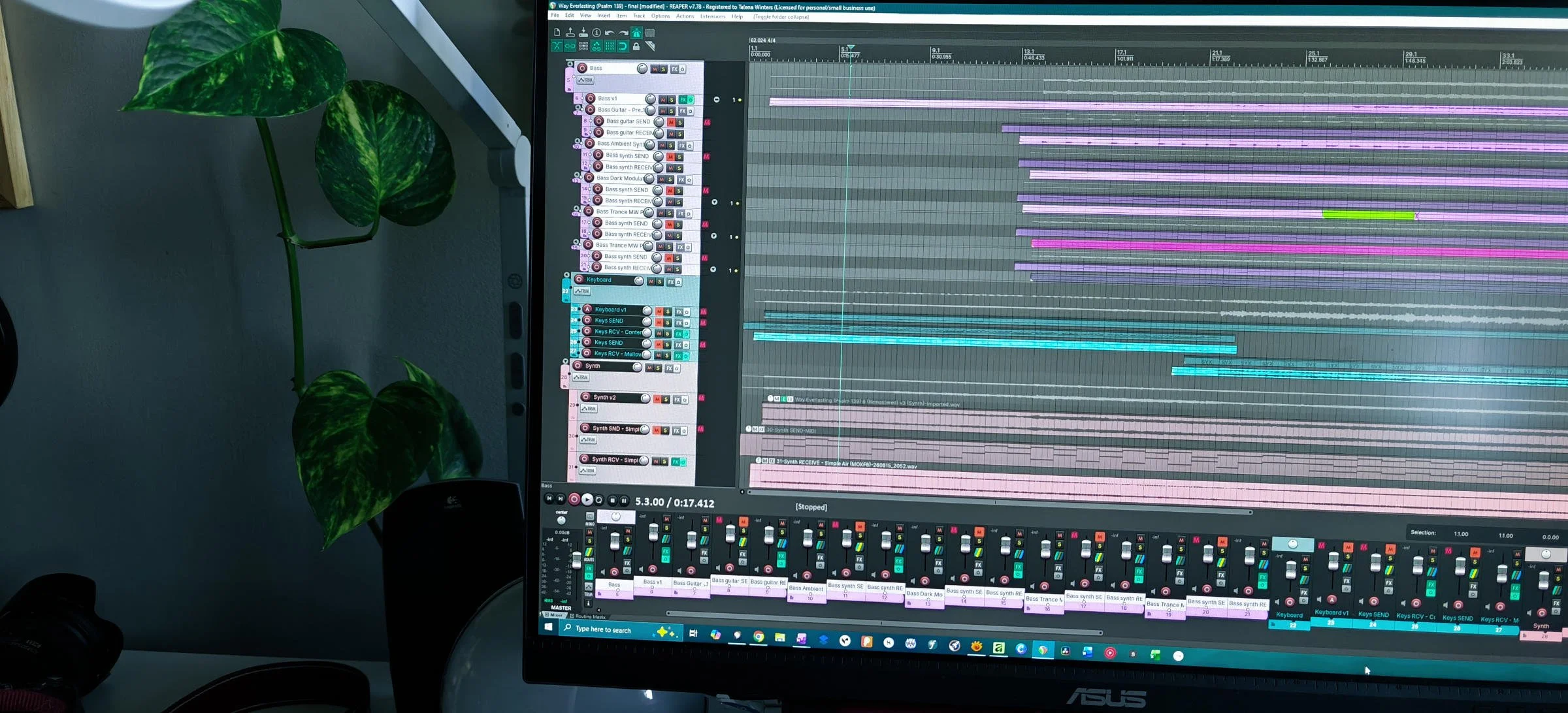 Photograph of a computer monitor open to a song recording project on a DAW.
