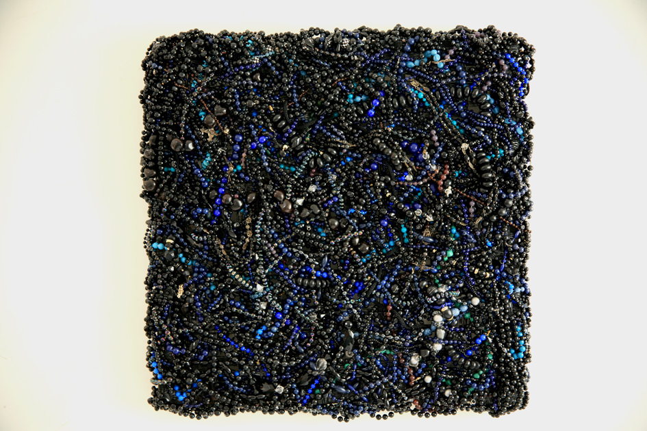   DANI MARTI     Monster (black)  2007 Second hand beaded necklaces and Spanish rosary beads collected between 2000 and 2003. Tubular mesh used for mussel farming on wood  66 x 66 cm 
