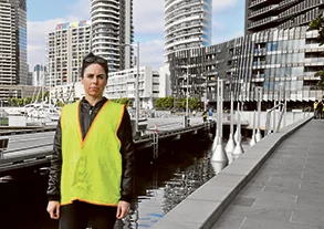 Image: the artist, Tracy Sarroff, with her installation Light Buoys, Docklands. 