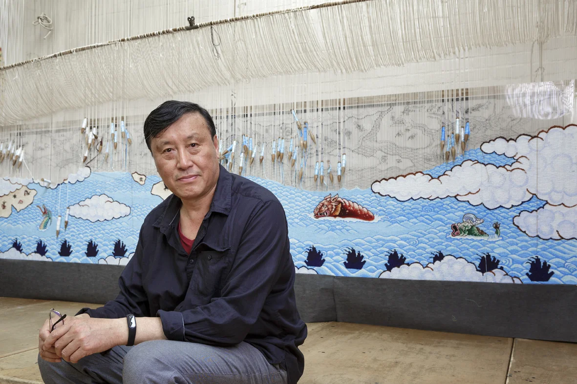Portrait of Guan Wei at The Australian Tapestry Workshop