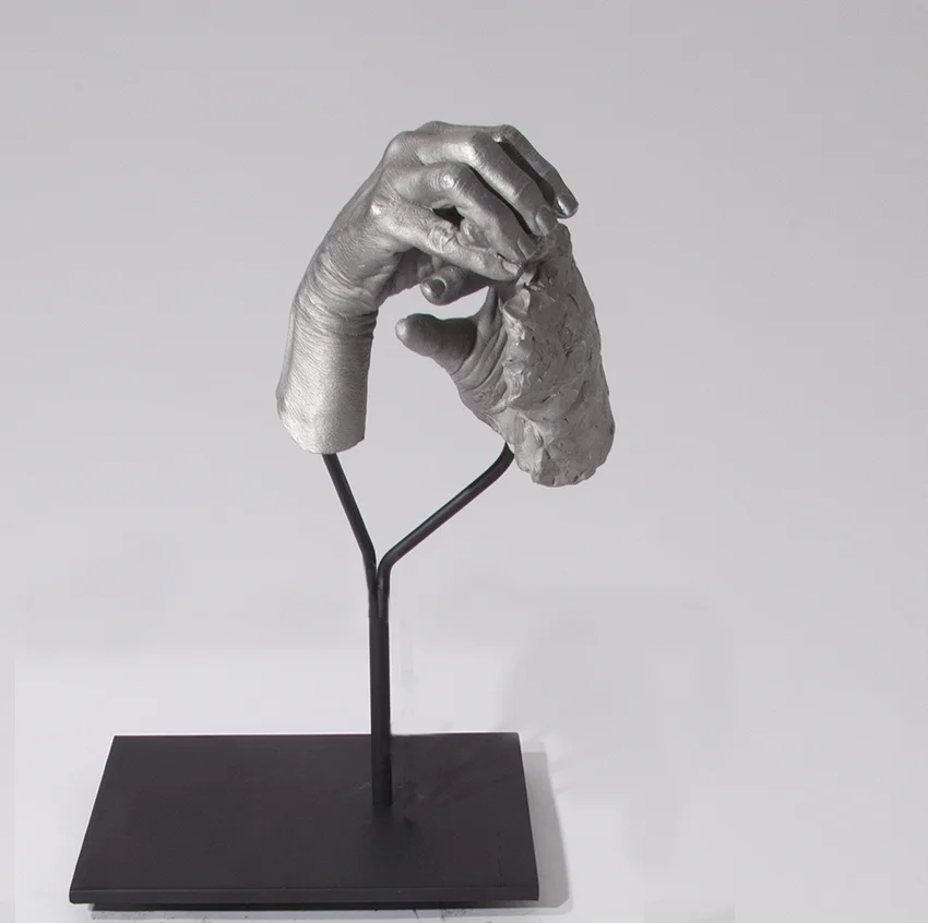 Julie RRAP, One Hand Making the Other Hand , 2016, cast aluminium and powder coated steel, 50 x 36 x 25cm.