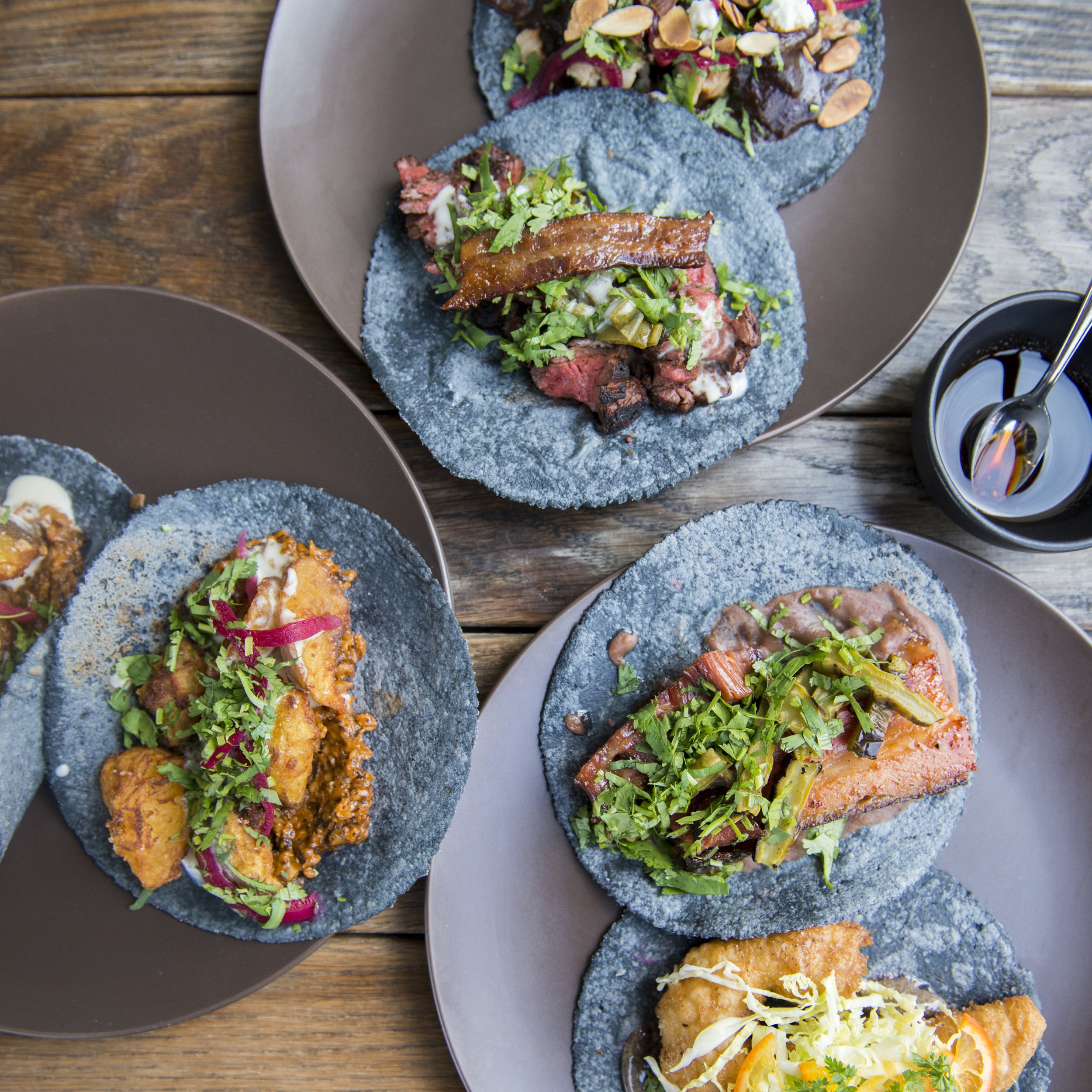 Assorted tacos in blue corn tortillas